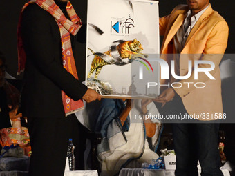 Actor Abhishek Bachhan , actor Irfan Khan  showing the poster of International Film Festival in Kolkata, India. (