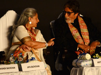 Jaya Bachhan talks with Amitabh Bachchan during the inauguration of the Kolkata International Film Festival in Kolkata, India. (