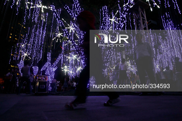 Makati City, Philippines - A boy plays in the park during the Festival of Lights in Makati City, south of Manila on November 12, 2014. The F...