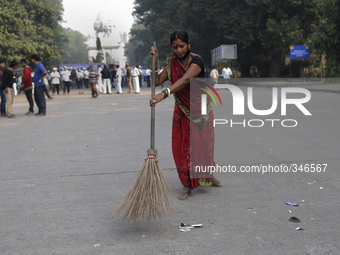 After the Governor of West Bengal left regular sweepers came in to clean the street during Clean India Campaign in Kolkata, India. (