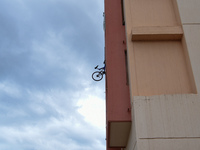 The balconies are very small - so the students are hanging chairs and bicycles outside the building(