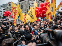Leader of the main opposition party, leftist Alexis Tsipras (C) participates in a protest rally marking a 24-hour general strike in Athens o...