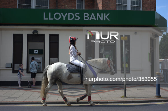 A branch of Lloyds, as a young person is passing on horseback, on November 27, 2014 in Nottingham, England. 
National and international ban...
