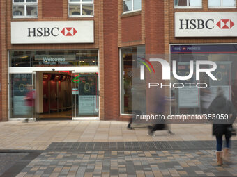 People walking on November 27, 2014 by a central Preston branch of the HSBC bank. 
National and international banks and building societies,...