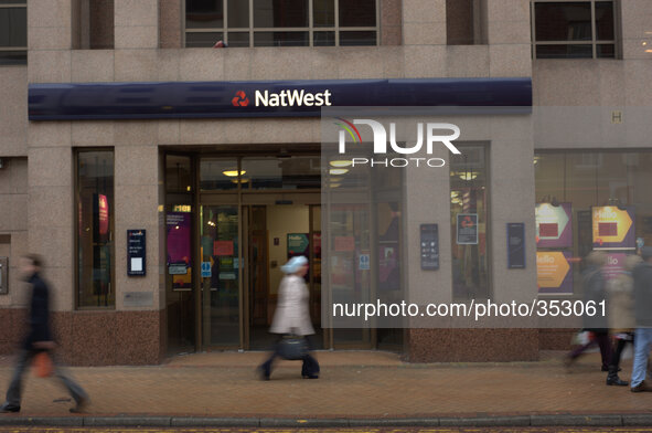 People walking by a branch of the Natwest Bank in Preston on November 27, 2014.
 