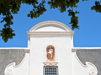 A view of the very tall gable of the 19th-century Manor House - Constancia Wine Estate winiards. Constantia Valley Wine Route, Cape Town, So...