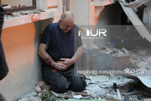 An injured man is seen after the explosion of a bakery on the corner of the streets Saint-Cecile and Rue de Trevise in central Paris on Janu...