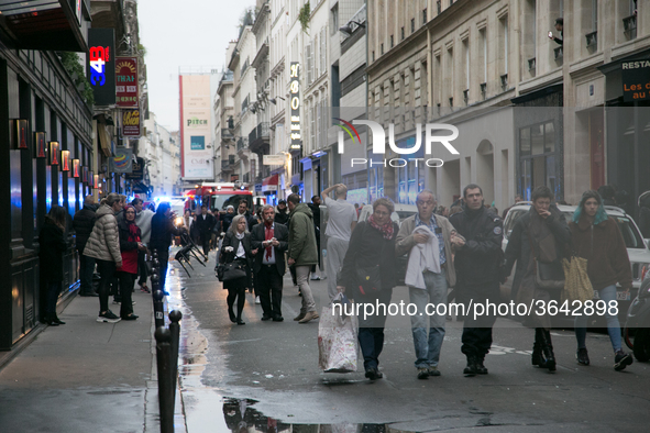 Injured people are seen after the explosion of a bakery on the corner of the streets Saint-Cecile and Rue de Trevise in central Paris on Jan...