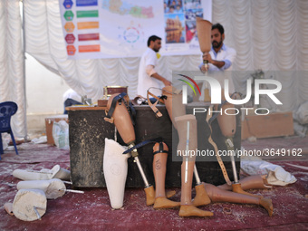 Artificial Limb Maker making different size and shapes of artificial Prosthetic legs fitted to Nepalese people during Artificial limb fitmen...