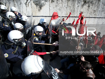 Greek school teachers and students clash with riot police during a protest outside the Greek Parliament in Athens, Greece on January 17, 201...