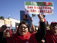 Striking teachers with the Los Angeles Unified School District and supporters of public education march in a parade honoring Dr. Martin Luth...
