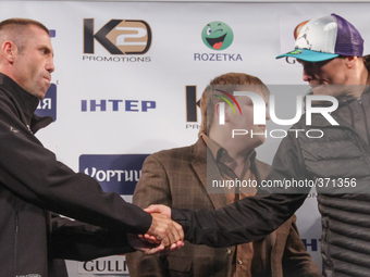 KIEV, UKRAINE - DECEMBER 12, 2014: World heavyweight boxing champion, Olympic champion Oleksandr
 Usyk(R) - Ukraine and Danie Venter(L) - So...