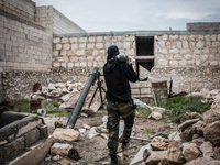 One of the rebels carrying mortar shell, in Aleppo, Syria, on December 13, 2014.  (
