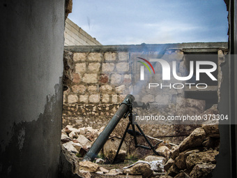 The moment of firing mortar shell from the cannon, in Aleppo, Syria, on December 13, 2014.  (
