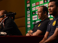 Malaysia coach Dollah Salleh (2-R) and Safee Sali (1-R) attends a press conference of the AFF Suzuki Cup 2014 final round 1st leg Thailand v...