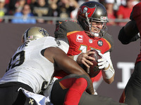 Tampa Bay Buccaneers quarterback Josh McCown (12) is tackled by New Orleans Saints outside linebacker Junior Galette (93) for a safety durin...