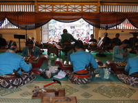 The musician plays Gamelan Kyai Guntur Madu in Pagongan Kidul  in front of the visitors in the courtyard of the mosque Kauman Kidul, Yogyaka...