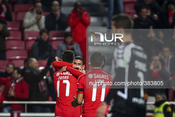 Benfica's forward Jonas (L) celebrates with team mater after scoring during the Portuguese League Cup  football match between SL Benfica and...