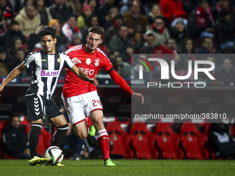 Nacional's midfielder Saleh Gomaa (L) vies with Benfica's midfielder Bryan Cristante during the Portuguese League Cup  football match betwee...