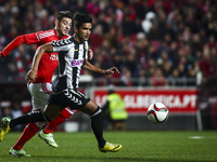 Nacional's midfielder Saleh Gomaa (R) vies with Benfica's forward Pizzi during the Portuguese League Cup  football match between SL Benfica...