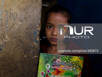A small girl namely Sadia, studies in class one smiles at the camera at a primary school close to Ship Breaking/Building yard in Keraniganj,...