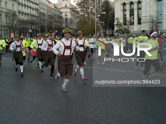 Disguised runners participate in the traditional Saint Silvester's Run to say goodbye to the year, in Madrid, central Spain, on New Year's E...