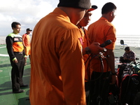 Indonesian SAR on the boat at the sea prepared for diving to find the victim body at Kalimantan Sea. Jan 2nd 2015 (