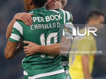 Sporting's midfielder Adrien Silva  (B) celebrates his goal with Sporting's forward Andre Carrillo (F)  during the Portuguese League  footba...