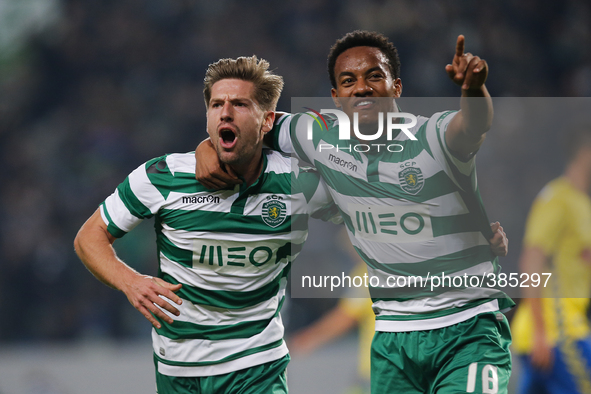 Sporting's midfielder Adrien Silva  (L) celebrates his goal with Sporting's forward Andre Carrillo (R)  during the Portuguese League  footba...