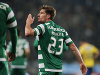 Sporting's midfielder Adrien Silva celebrates his goal during the Portuguese League  football match between Sporting CP and Estoril Praia at...