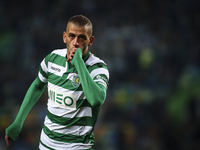 Sporting's forward Islam Slimani celebrates after scoring during the Portuguese League  football match between Sporting CP and Estoril Praia...