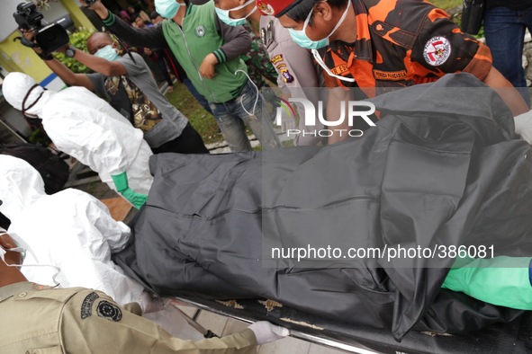 Imanudin hospital at pangkalan bun-kalimantan prepares the coffin for the victim of air asia plane crash. The Search and resque team who del...