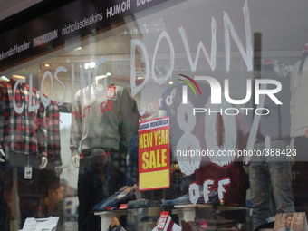 A window advert displaying the closing down sale to potential customers. (
