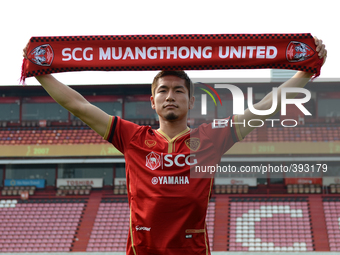 Naoaki Aoyama of Muangthong United poses for a picture with a scarf after signing for the club at SCG Stadium in Nonthaburi, Thailand on Jan...