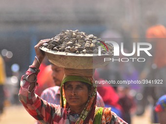An Indian women works at a constructions site on the eve of International Women’s Day in Dimapur, India North eastern state of Nagaland on T...