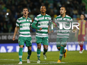Sporting's midfielder Nani (C) celebrates his goal with Sporting's defender Cedric (L) and Sporting's defender Jefferson (R)  during the Por...
