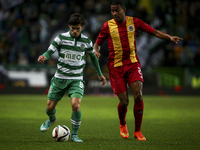 Sporting's midfielder Andre Martins (L)  vies with Rio Ave's forward Marvin Zeegelaar during the Portuguese League football match between Sp...