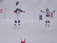 (L-R) Hannah Kearney (USA) and  Yulia Galysheva (KAZ), sprint for the place in final, in Ladies' Dual Moguls Semi-Final, at FIS Freestyle Wo...