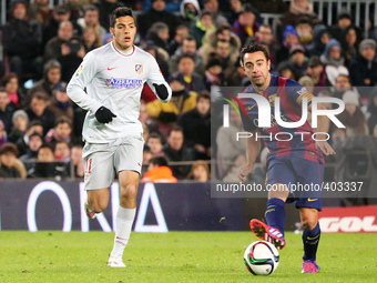 BARCELONA -21 january- SPAIN: Xavi Hernandez and Raul Jimenez in the match between FC Barcelona and Atletico Madrid, for the first leg of th...