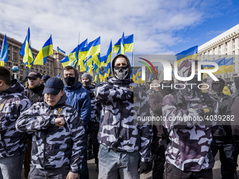 Far right protesters make army salute in a demonstration against ukrainian government corruption in Maidan Square, Kiev, Ukraine, on 23 Marc...