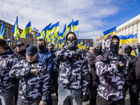 Far right protesters make army salute in a demonstration against ukrainian government corruption in Maidan Square, Kiev, Ukraine, on 23 Marc...
