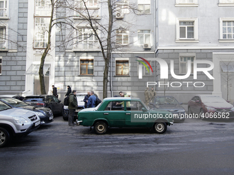 A vintage Soviet car is seen parked in front of the administrative building of the Verkhovna Rada, parliament in Kyiv, Ukraine on March 28,...