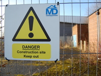 A sign warning people that there are risks associated with entering the site and that they should keep out. (