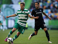 Sporting's midfielder Adrien Silva (L) vies for the ball with Academica's midfielder Nuno Piloto (R)  during the Portuguese League  football...