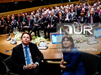 Dutch minsiter of foreign affairs Bert Koenders (L) and minister of foreign trade Lilianne Ploumen (R) are seen watching a film at the intro...