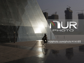 Man rides a bike in Coventional Center in Futian district, Shenzhen on January 30, 2015.
Shenzhen is located in the Guangdong province just...