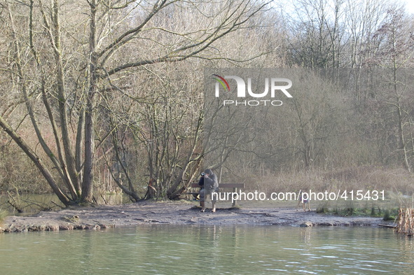 A person, sitting down in the Heaton Mersey Common taking photographs on Saturday 31st January 2015. 