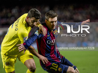 Barcelona, Catalonia, Spain. Fabruary 1, 2015 Leo Messi of Barcelona and Musacchio of Villarreal in action during the spanish league match b...