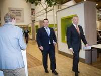 KPN chairman Eelco Blok (R) and CFO Jan Kees de Jager (M) are seen arriving at the press presentation of the yearly results in The Hague on...