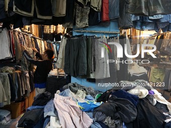 JAKARTA, INDONESIA - February 04 :  People buys a secondhand clothes at Senen Market in Jakarta, Indonesia, on February 04, 2015. Indonesian...